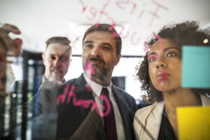businesspeople planning glass wall 1